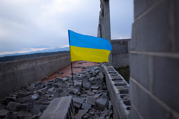 Flag of Ukraine amidst the rubble