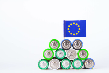Battery. A lot of batteries on the background of the flag of the country.