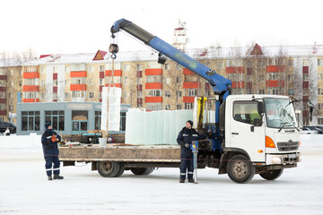 Installers unloading ice blocks for an ice town