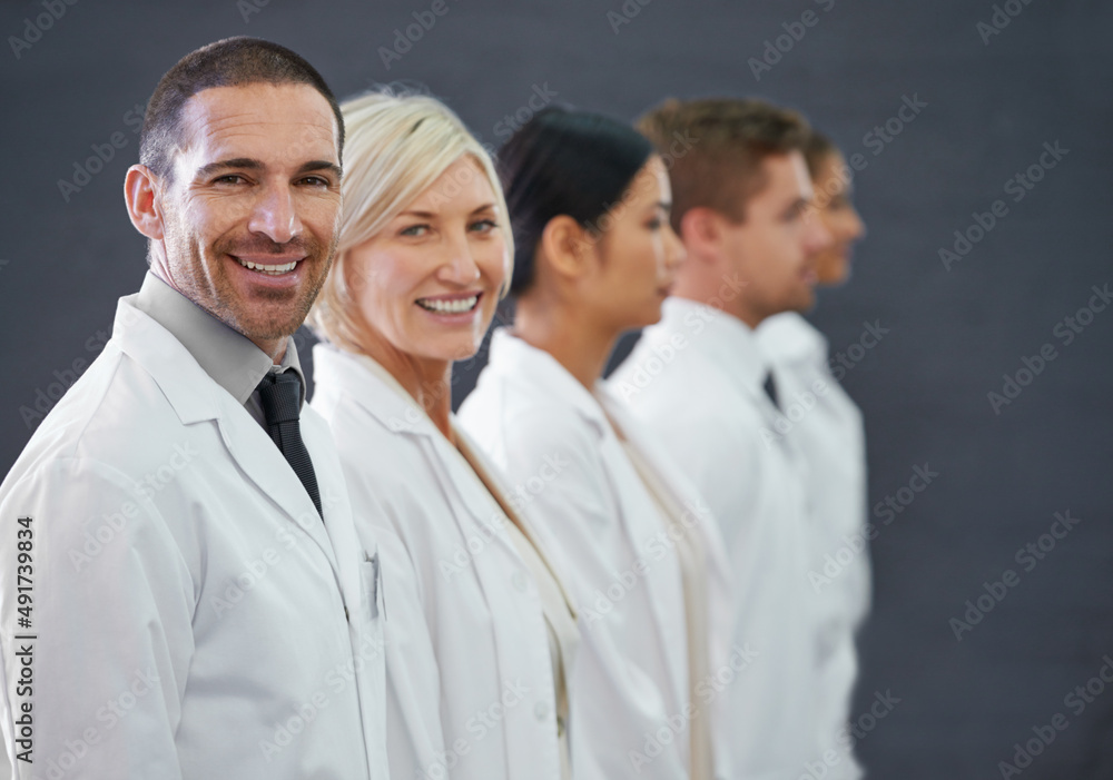 Aufkleber your first line of defense against illness. cropped shot of a group of doctors standing in a row.