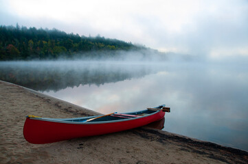 Red Canoe on a lake at Algonquin Park