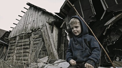 A child is crying^ playing in the ruins