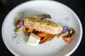 Herb Crusted Salmon. Grilled salmon steak with lemon mushroom and potatoes