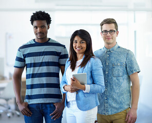 Obraz premium The best in the business. Cropped portrait of three coworkers standing in the office.