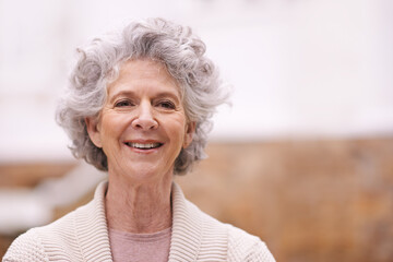 Retirement suits her. Portrait of a smiling senior woman standing outside.