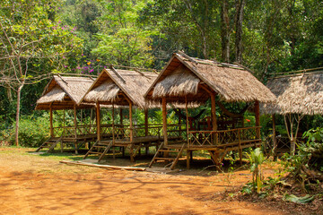 Fototapeta na wymiar huts in the jungle at Kuang Si Falls