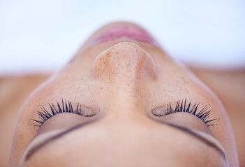 Naklejka premium Shes in a deeply relaxed state of mind. Cropped shot of an attractive young woman lying on her back.