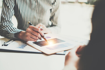 Analytics intelligence concept. Group of business people discuss current financial and economic on laptop for investment at the meeting.