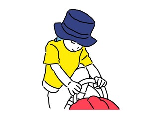 公園の遊具によじ登る男の子