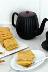 Slice Lapis Legit on Plate, Indonesian Layer Cake or Lapis Legit on Ceramic Plate, White Concept...
