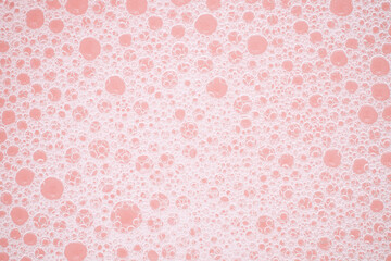 pink background with white foam.