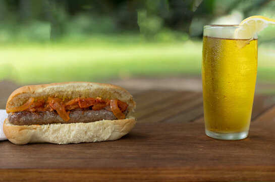 boerewors roll with a glass of cider