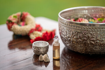 Flower garlands, water bowls, perfume and white clay filler for Buddha bathing ceremony on important religious days for Buddhists, New Year's and Songkran Festivals for Asians.
