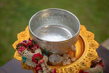 Flower garlands, water bowls, perfume and white clay filler for Buddha bathing ceremony on important religious days for Buddhists, New Year's and Songkran Festivals for Asians.