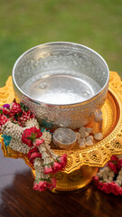 Flower garlands, water bowls, perfume and white clay filler for Buddha bathing ceremony on important religious days for Buddhists, New Year's and Songkran Festivals for Asians.