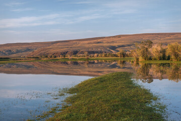 lake mountains dawn grass clouds reflection summer