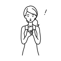 立ってスマートフォンを操作して何かに気づいて驚いたドレスの女性