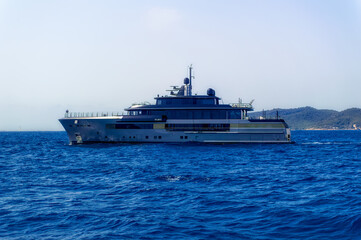 Fototapeta na wymiar Luxury yacht anchored at bay of island of Ibiza, Spain.