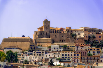 A sea side view to the Ibiza Old Town with Cathedral of Santa Maria d`Eivissa at the top of the hill in Ibiza, Spain.