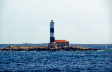 Old lighthouse at small Ballearic island close to island of Formentera, Spain.