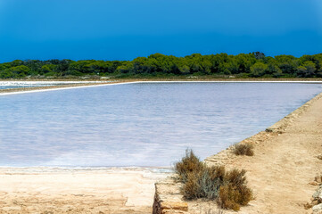 Sea salt field during hot summer day at Formentera island, Spain.