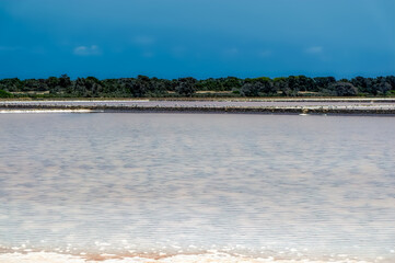 Sea salt field during hot summer day at Formentera island, Spain.