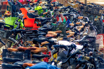 Many bicycles, mostly rented from tourists, parked during summer day at island of Formentera, Spain.
