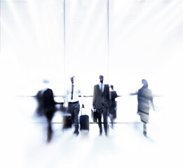 Rushing through the daily grind. Blurred shot of a businesspeople commuting.