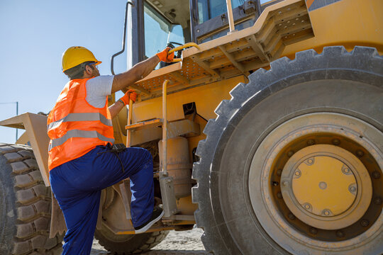 Experienced construction worker working hard at factory