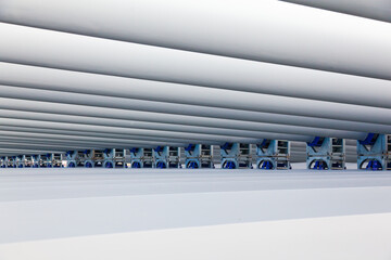 The blades of the wind stations are fixed and piled on the berth before departure.