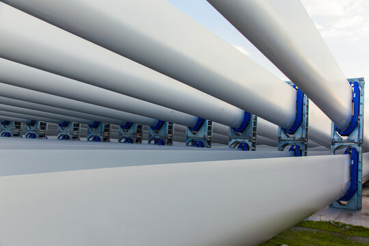 The blades of the wind stations are fixed and piled on the pier before departure from the city of Izmir Turkey.