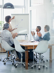 She keeps them motivated with her inspiring presentations. Shot of a businesswoman being applauded...