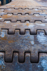 Close-up metal tracks of a crawler crane.