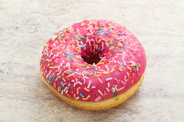 Sweet glazed struwberry donut with icing