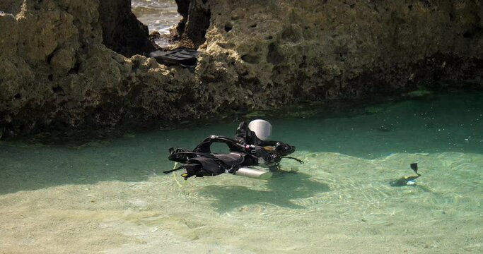 buoyancy compensator and oxygen tank floating on water diving equipments floating on ocean water dive vest floating