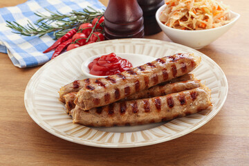 Grilled sausages with cabbage and sauce