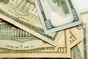 Money, US dollar bills background. Banknotes scattered on the desk. Photography for Finance and Economy.