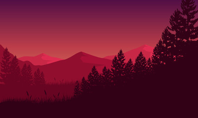 Fantastic mountain view with the silhouette of the lush pine trees from outside the city at sunset