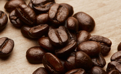 Theyre called energy beans. Still life shot of coffee beans on a wooden countertop.
