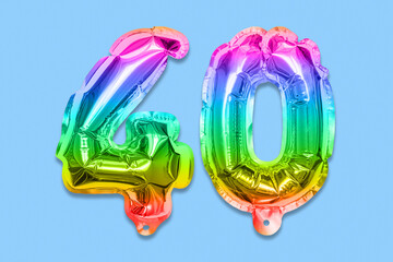 Rainbow foil balloon number, digit forty on a blue background. Birthday greeting card with...