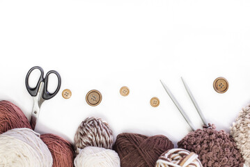 Vintage Knitting needles and yarn on wooden background. natural wool knitting top view. knitting...
