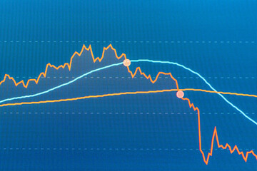 Crisis business finance curve blue background Investment, marketing crisis concept.Blurred image...