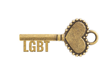 Bronze vintage antique key with word LGBT and heart shape isolated on white background