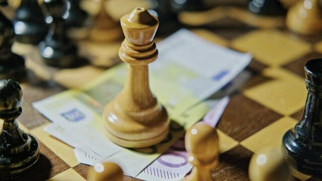 Euro money on a vintage chessboard with retro chess pieces