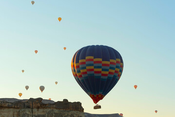 Fototapeta premium Hot air balloons in the sky during sunrise. Travel, dreams come true concept