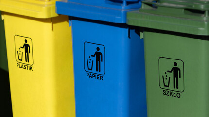 Three garbage containers for garbage segregation, close up —yellow 