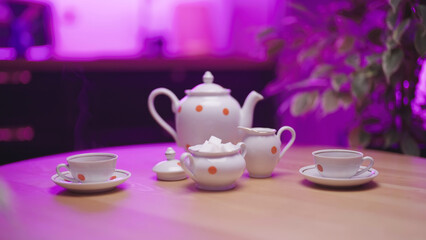 Served for a tea party with retro tea cups and teapot porcelain