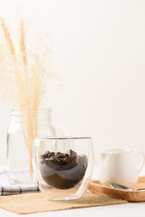 Grass jelly dessert with milk on white background, Traditional sweets that are cultural heritage of Asia.