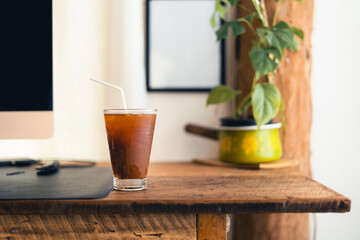 iced black coffee in a cup in the room