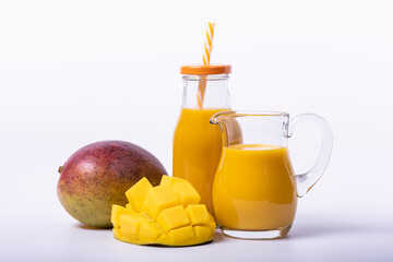 fresh mango smoothie and portion of chopped mango. Copy space